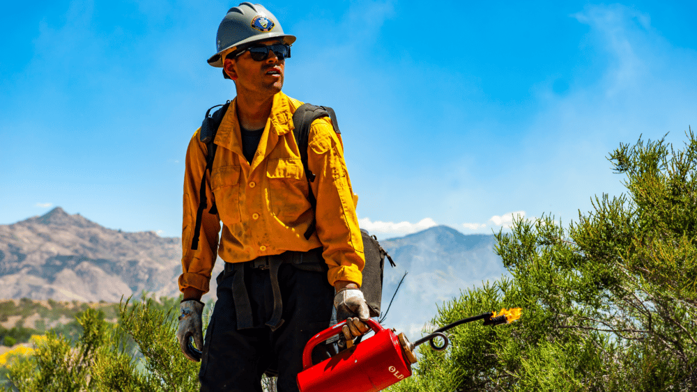 Firefighter deep breathing while battling a fire in California